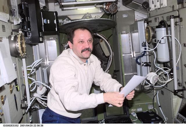 NASA image: Usachev with checklist in Service Module
