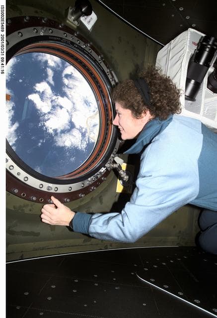 NASA image: Helms at photo quality window in Destiny Laboratory module