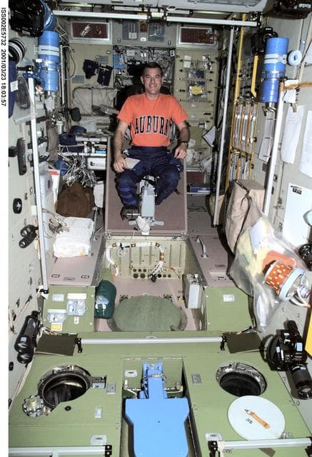 NASA image: Voss in Service module with cycle ergometer