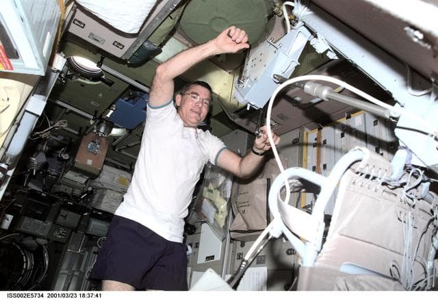 NASA image: Voss in Service module with cycle ergometer