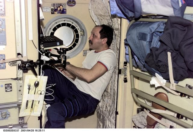 NASA image: Usachev at sleep station in Service Module