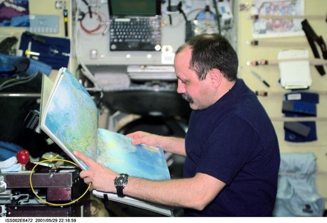 NASA image: Usachev with atlas in Service Module
