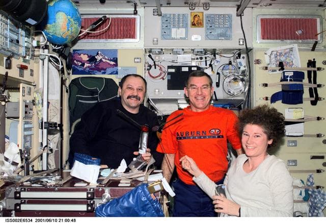 NASA image: Expedition Two crew share dessert in Zvezda module