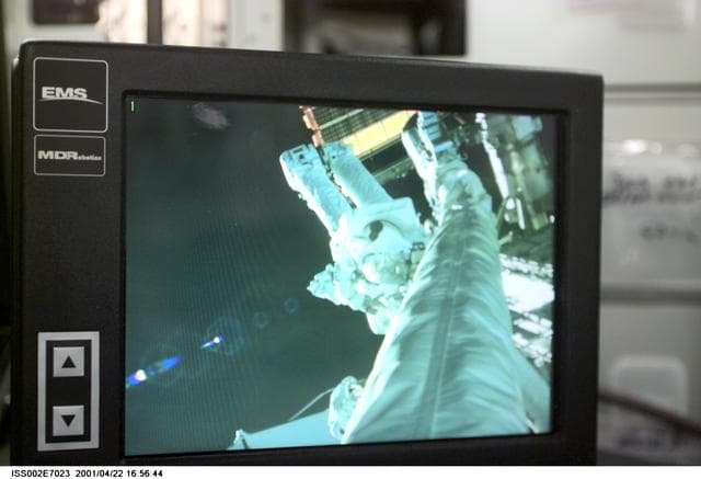 NASA image: View of STS-100 MS Hadfield during EVA 1 as seen on a monitor in the ISS
