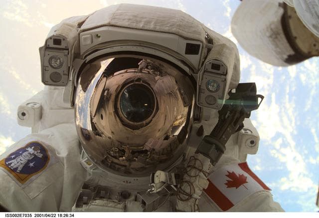 NASA image: View of STS-100 MS Hadfield during EVA 1 at Destiny laboratory window