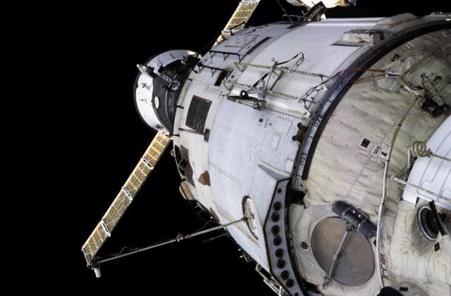 NASA image: View of the nadir side of the ISS taken during the first EVA of Expedition Three