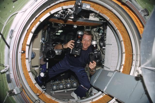 NASA image: Culbertson photographs the opening of the hatch to the Pirs during Expedition Three