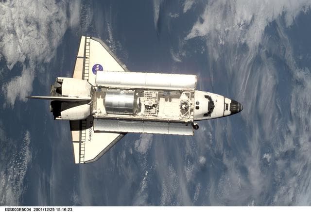 NASA image: View of Discovery approaching the ISS for docking during the STS-105 mission