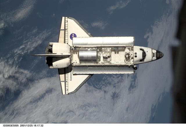 NASA image: View of Discovery approaching the ISS for docking during the STS-105 mission