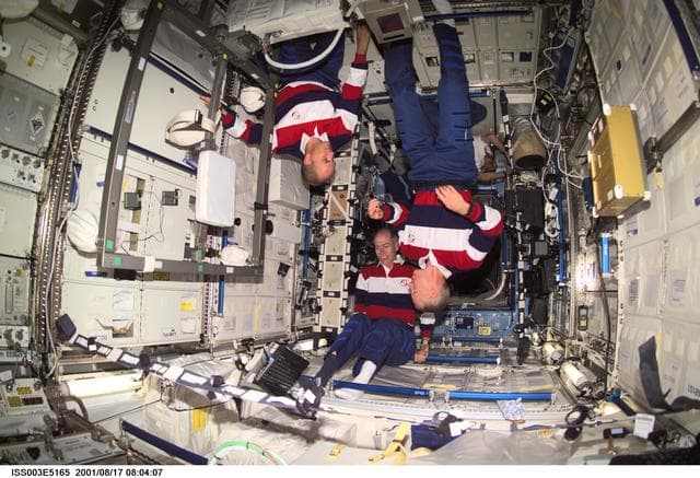 NASA image: Sturckow, Barry and Forrester work in the U.S. Laboratory