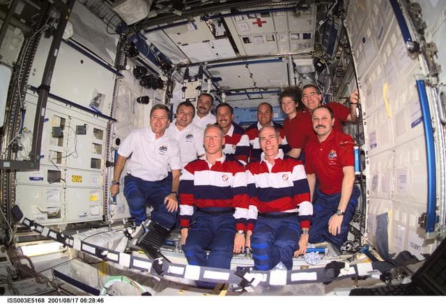 NASA image: Expedition Three, Expedition Two and STS-105 crews pose in the U.S. Laboratory