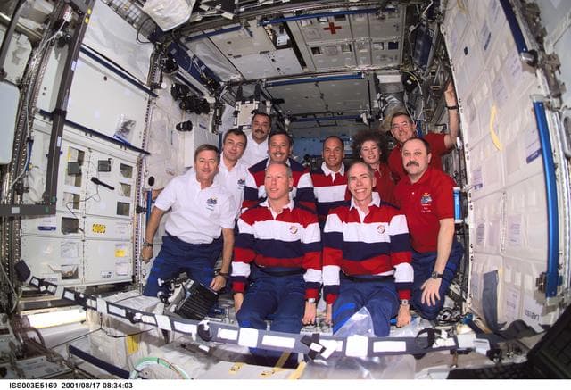 NASA image: Expedition Three, Expedition Two and STS-105 crews pose in the U.S. Laboratory