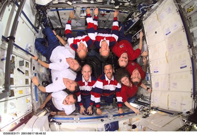NASA image: Expedition Three, Expedition Two and STS-105 crews pose in the U.S. Laboratory