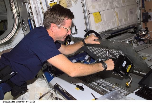 NASA image: Culbertson performs inflight maintenance in Node 1 during Expedition Three