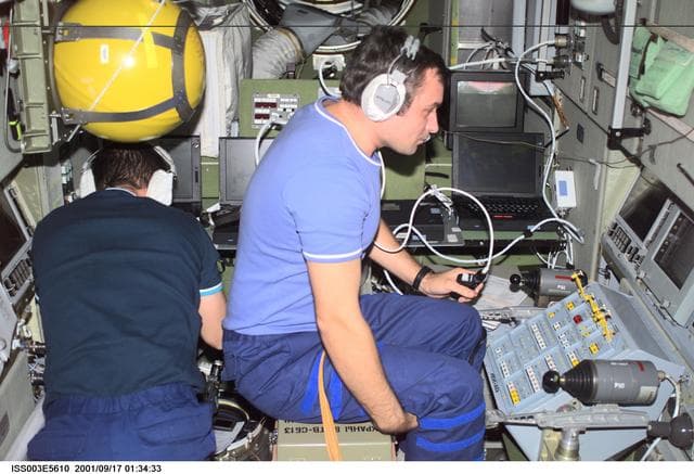NASA image: Dezhurov and Tyurin work in Zvezda during Expedition Three
