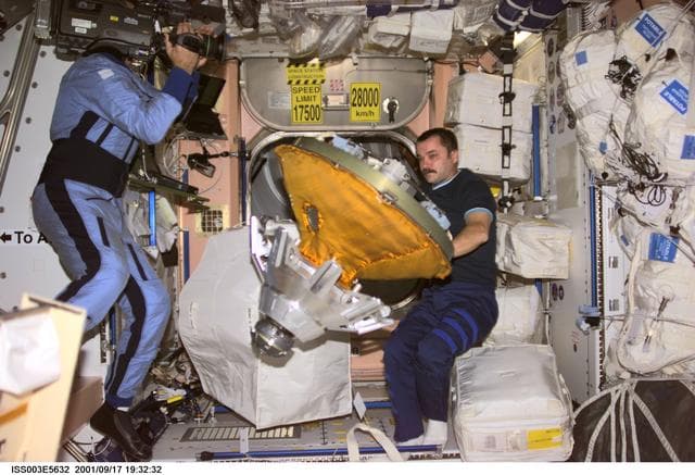 NASA image: Tyurin packs the docking probe in Node 1 during Expedition Three