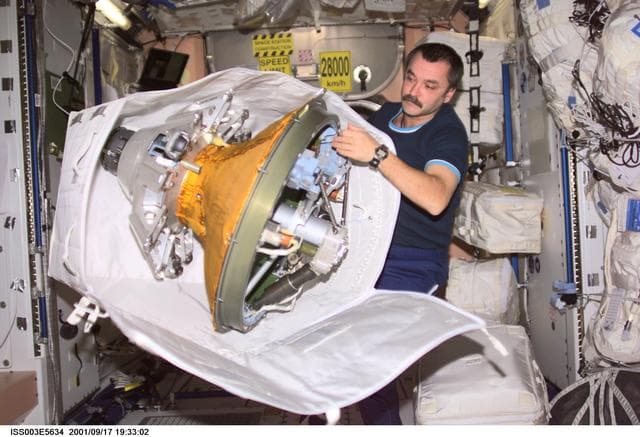 NASA image: Tyurin packs the docking probe in Node 1 during Expedition Three