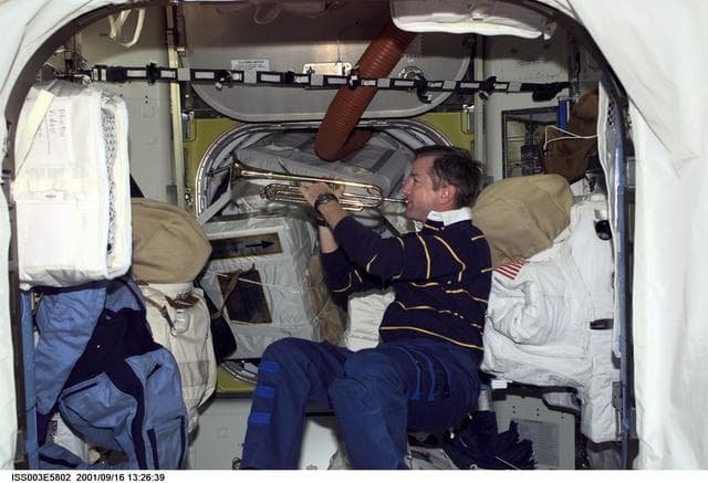 NASA image: Culbertson plays a trumpet in the Airlock during Expedition Three