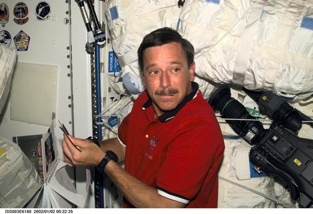 NASA image: STS-105's Horowitz works on a mission logo in Node 1