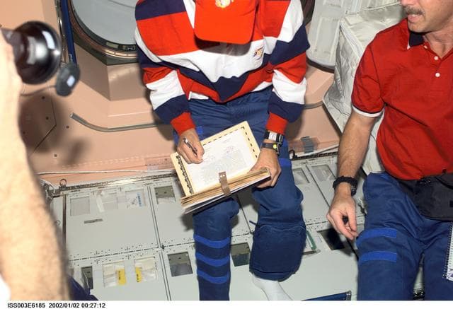 NASA image: Horowitz and Sturckow with the ISS logbook in Node 1