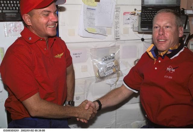 NASA image: Sturckow is presented with a military award by Forrester in Node 1