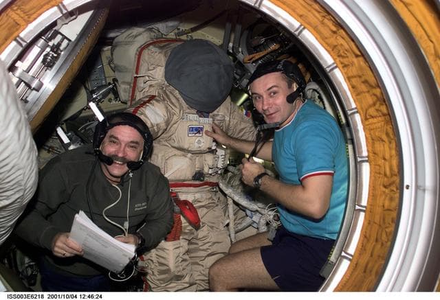 NASA image: Dezhurov and Tyurin work on an Orlan suit in Pirs during Expedition Three