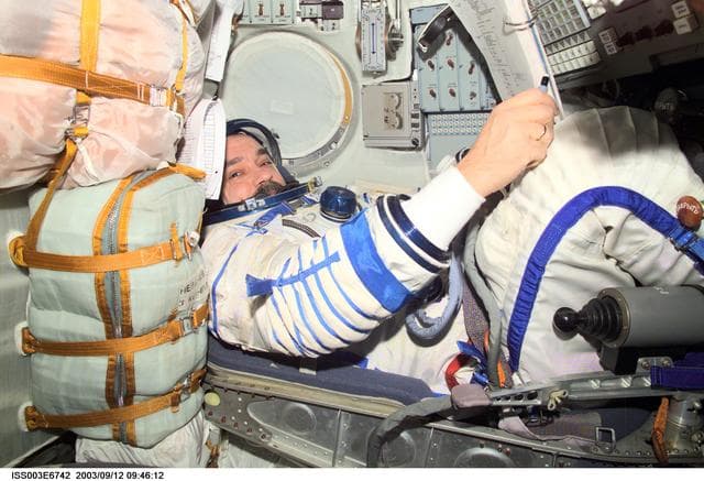 NASA image: Tyurin is seated in the Soyuz spacecraft during Expedition Three