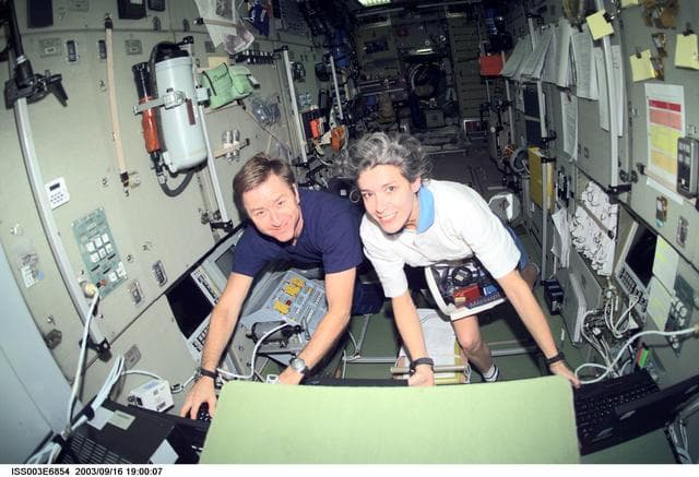 NASA image: Culbertson and Haignere work in the Service Module during Expedition Three