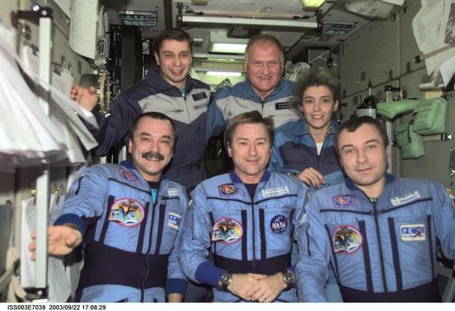 NASA image: Taxi and Expedition Three crews pose for a group photo in Zvezda during Expedition Three