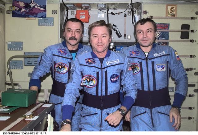 NASA image: Expedition Three crew pose for a group photo in Zvezda during Expedition Three