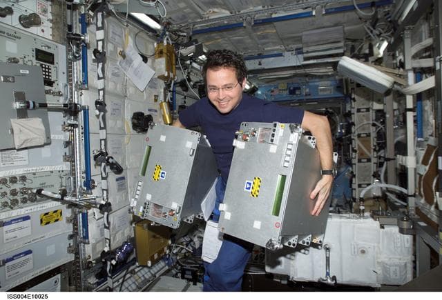 NASA image: Bursch performs transfer OPS in the U.S. Lab during STS-110, Expedition Four joint OPS