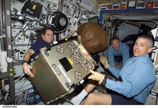 NASA image: Bursch, Morin, & Ross transfer BPS-PESTO into the U.S. Lab during STS-110, Expedition Four joint OPS