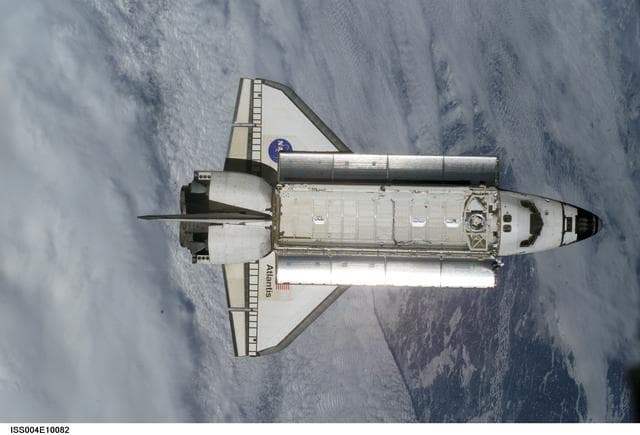 NASA image: STS-110 Shuttle Atlantis separates from the ISS following undocking, Expedition Four