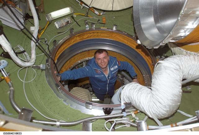 NASA image: Soyuz 4 CDR Gidzenko flies through the Zvezda PA during Expedition Four