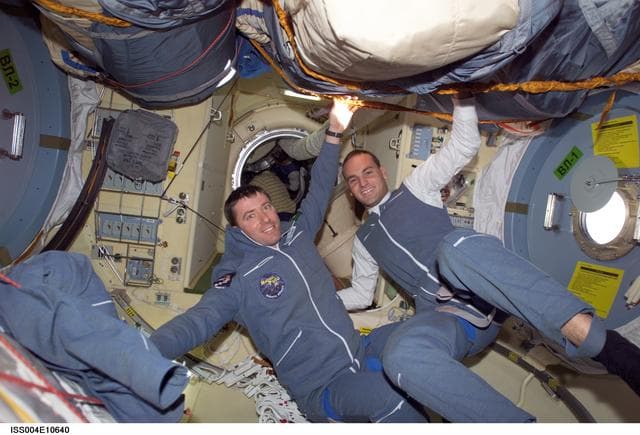NASA image: Soyuz 4 FE Vittori and SFP Shuttleworth pose in the FGB during Expedition Four