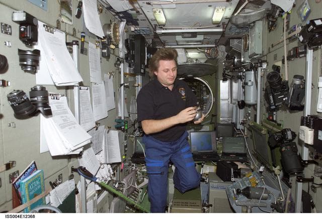 NASA image: Onufrienko holds a Grab Sample Container (GSC) in the SM during Expedition Four
