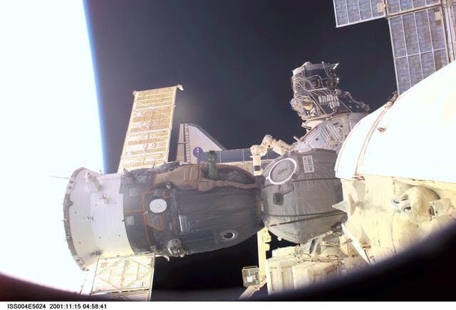 NASA image: ISS, Soyuz, and Endeavour undocking seen from the SM during Expedition Four