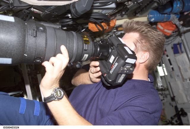 NASA image: Onufrienko holds the Digital Camera System (DCS) in  Zvezda SM during Expedition Four
