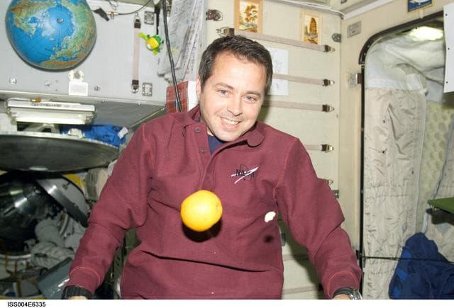 NASA image: Bursch with fresh fruit in the Zvezda SM, Expedition Four