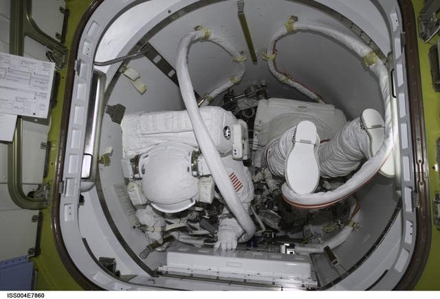 NASA image: Walz and Bursch in Quest Airlock during EVA 3 dry run, Expedition Four
