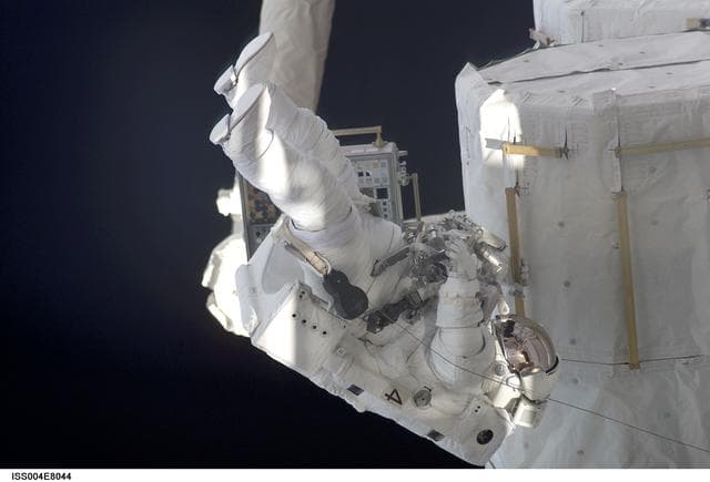 NASA image: Bursch on outside of Quest Airlock during EVA 3, Expedition Four