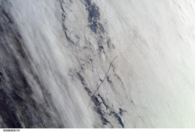 NASA image: STS-109 launch plume observation as seen from ISS during Expedition Four