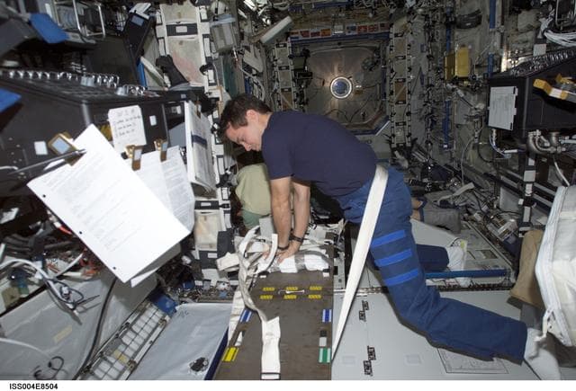 NASA image: Bursch practices CPR in the U.S. Laboratory during Expedition Four
