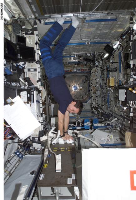 NASA image: Bursch practices CPR in the U.S. Laboratory during Expedition Four