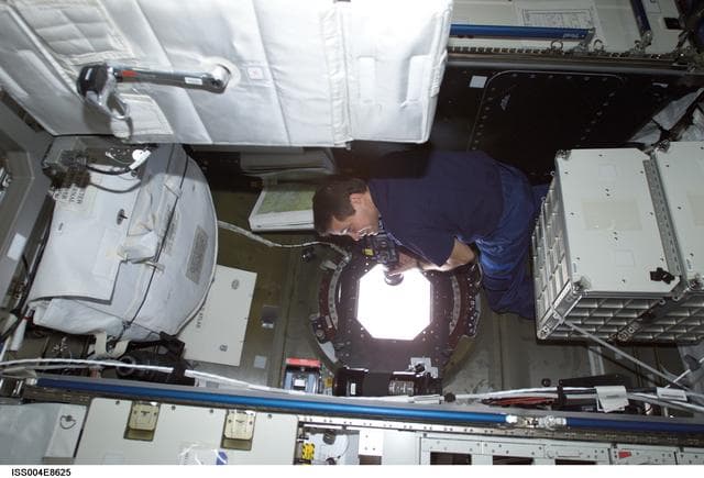 NASA image: Bursch takes Earth OBS photos from U.S. Laboratory window during Expedition Four