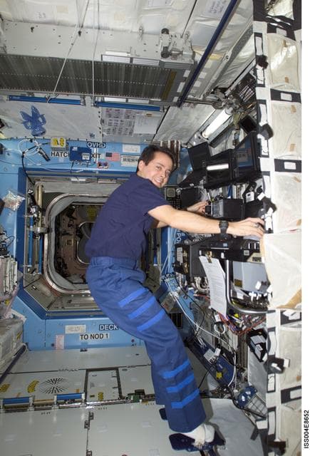 NASA image: Bursch works with SSRMS controls in the U.S. Laboratory during Expedition Four