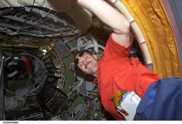 NASA image: STS-110 MS Smith in Zvezda PA during Expedition Four on first day of joint OPS