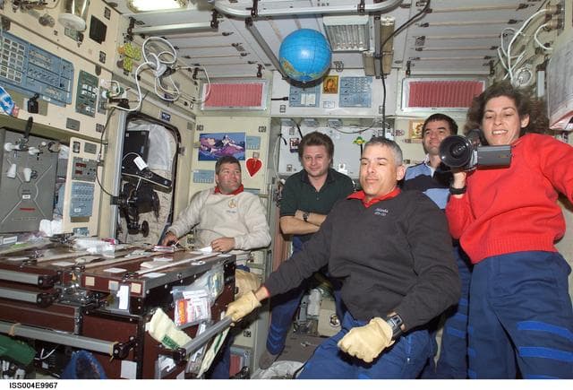 NASA image: STS-110 and Expedition Four crews gather in the Zvezda SM on first day of joint OPS