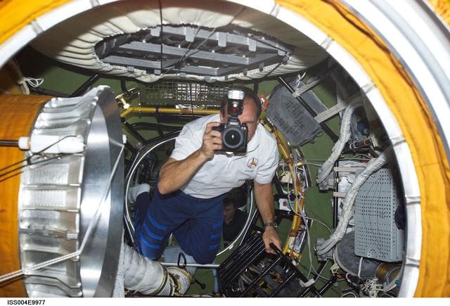 NASA image: STS-110 CDR Bloomfield in Zvezda PA during Expedition Four on first day of joint OPS