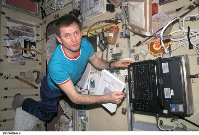NASA image: Treschev works on laptop computer in the SM taken during Expedition Five on the ISS